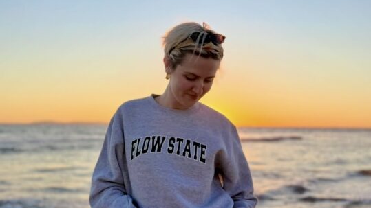 young person wearing a Flow State sweatshirt